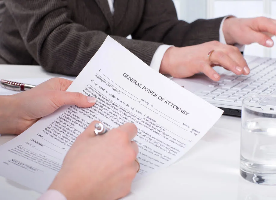 Power of attorney paperwork with pen signing