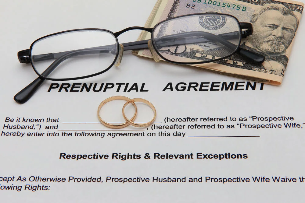 A Rhode Island divorce attorney, Bryan Nappa, works on a prenuptial agreement between a future husband and wife in Rhode Island
